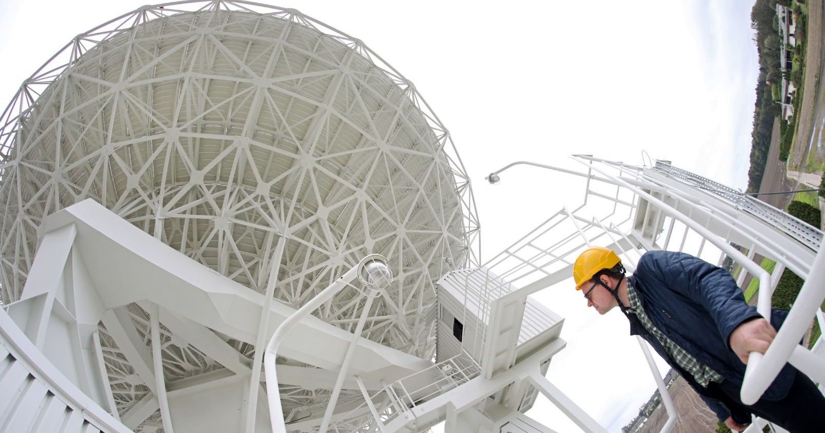 Dr Paweł Wolak at the radio telescope RT-4 in Piwnice Dr Paweł Wolak at the radio telescope RT-4 in Piwnice