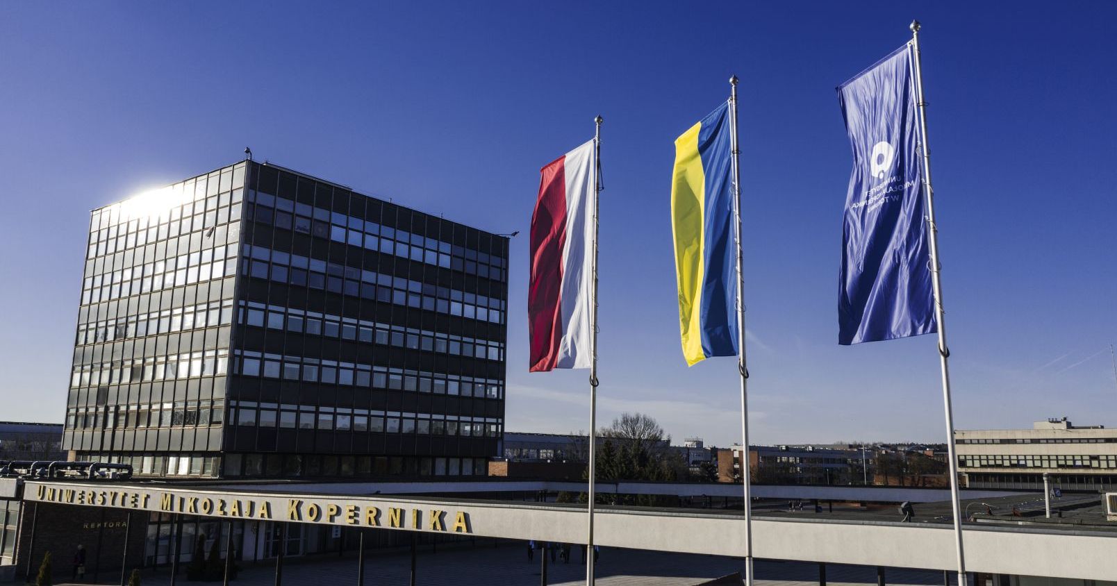  Three flags (NCU, Polish and Ukrainian) on university campus