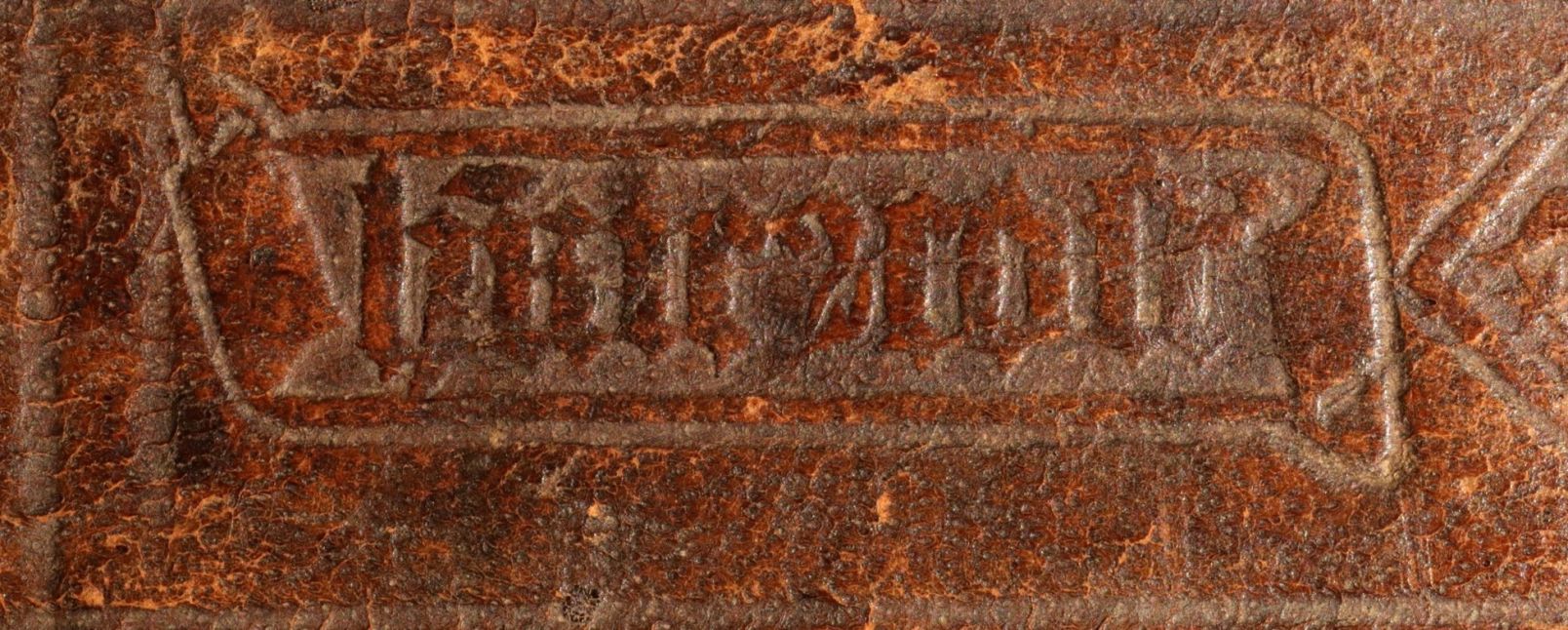 Bookbinder's stamp with signature on the Bible's binding